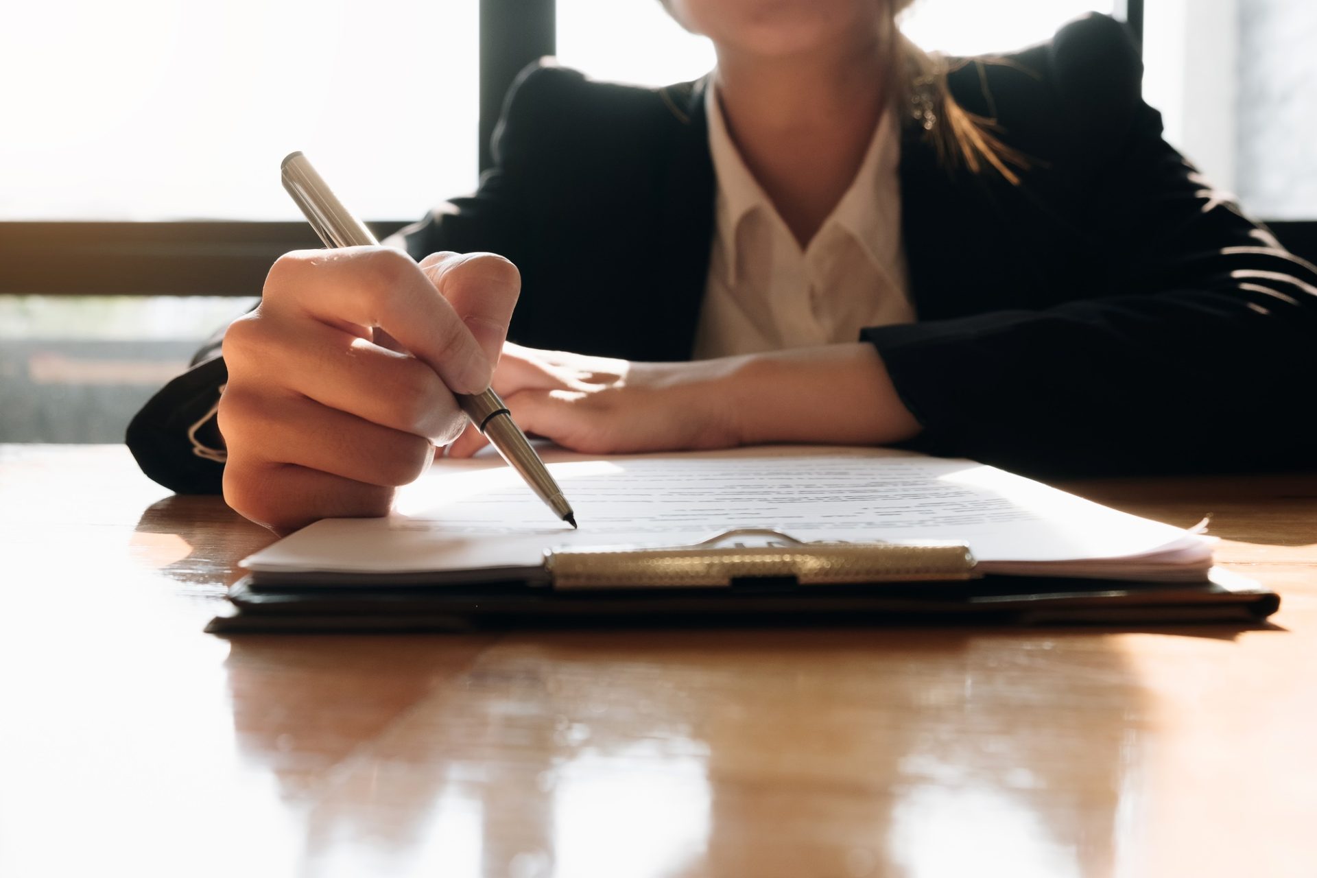 Close up business man signing contract making a deal with business partner - Business deal concept